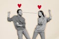 Creative collage of two positive black white effect people dancing look each other eyes connection drawing hearts