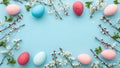 Colorful Easter eggs and blossoming flowers on a light blue background Royalty Free Stock Photo