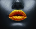 Creative colorful makeup. Bodyart, lipgloss on sexy lips, girls mouth. Golden lips on black skin Royalty Free Stock Photo