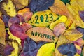 Creative colorful year 2023 November autumn fall concept with leaves.