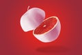 Creative combination of sliced pink apple and grapefruit Royalty Free Stock Photo