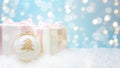Creative composition with Christmas gift boxes and bauble decoration on abstract bokeh background. Minimal Christmas or New Year Royalty Free Stock Photo
