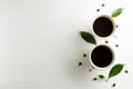 Creative composition cup of coffee with coffee beans and leaf on Royalty Free Stock Photo