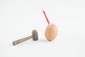 Creative composition with Easter egg, hammer and nail. Minimal holiday concept Royalty Free Stock Photo
