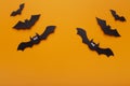 Creative composition of Halloween bats on orange background