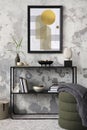 Creative composition of living room interior with mock up poster frame, black consola, grey pouf with plaid, carpet, coffee table