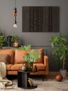 Creative composition of living room interior with mock up poster frame, brown sofa, plants in flowerpots, black coffee table, Royalty Free Stock Photo