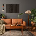 Creative composition of living room interior with mock up poster frame, brown sofa, plants, wooden coffee table, lamp, ball, Royalty Free Stock Photo