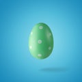 Creative composition made of green Easter egg. Minimal spring or summer Holiday concept. Fun background