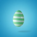 Creative composition made of green Easter egg. Minimal spring or summer Holiday concept. Fun background Royalty Free Stock Photo