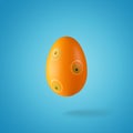 Creative composition made of orange Easter egg. Minimal spring or summer Holiday concept. Fun background Royalty Free Stock Photo