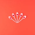 Creative composition made of white forks with red candy hearts on red background