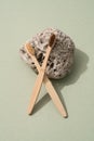 Creative composition with natural bamboo toothbrushes with stone on green background Royalty Free Stock Photo