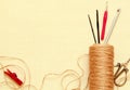 Creative composition with natural jute twine roll, hooks, red clothespin and decorative scissors, on a light burlap background Royalty Free Stock Photo