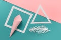 Creative composition with paper origami shapes on pink blue background