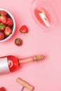 Creative composition with rose wine and delicious strawberries on the pink background Royalty Free Stock Photo