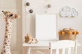 Creative composition of stylish and cozy child room interior design with eucalyptus wall, plush toys, furniture and accessories. P Royalty Free Stock Photo