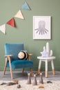 Creative composition of stylish and cozy child room interior design with green wall, plush toys, bright carpet, blue armchair,