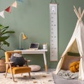 Creative composition of stylish and cozy child room interior design with green wall, plush toys, plant in basket, lamp, bright Royalty Free Stock Photo