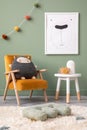 Creative composition of stylish and cozy child room interior design with green wall with poster, plush toys, bright carpet, orange Royalty Free Stock Photo