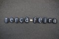 Terca-feira, third day of the week in portuguese language composed with black colored stone letters over black volcanic sand
