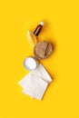 Creative concept of eco-friendly natural cleaning products on yellow kitchen table: soda, essential oils, cellulose sponge, rags,