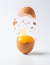 Creative Concept - An Egg Cracking Open in Mid-Air Royalty Free Stock Photo