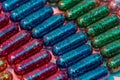 Creative concept with many colorful glitter pills lying in rows diagonally. Minimal style, art concept Royalty Free Stock Photo