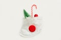 Creative concept of the new year amid coronavirus. christmas medical flatlay. Medical mask, gift, Christmas decorations on a white