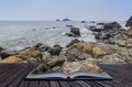 Creative concept pages of book Rocky shore and Brisons Rock in d Royalty Free Stock Photo