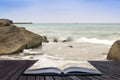 Creative concept pages of book Sennen Cove beach before sunset i