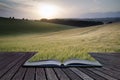 Creative concept pages of book Summer landscape image of wheat f