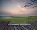 Creative concept pages of book Summer sunrise over landscape of Royalty Free Stock Photo