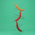 Creative Concept : Red peppers impaled floating on green background. Minimal food idea concept.