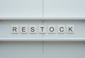 Creative Concept of Restock Strategy with Tiles on White Shelf Background Royalty Free Stock Photo
