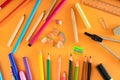 Creative concept of school supplies on an orange background. Welcome back to school. Top view. Flat lay Royalty Free Stock Photo