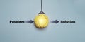 Creative concept showing the transition from problem to solution with a glowing yellow idea symbol representing innovation, Royalty Free Stock Photo