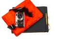 Creative concept of a vintage camera and colorful photo albums isolated on white background Royalty Free Stock Photo