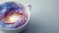 Creative concept of a white cup filled with a swirling colorful galaxy representing imagination and infinite possibilities on a Royalty Free Stock Photo