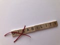 Creative Concept : the word Disability in wooden letters