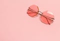 Creative coral trendy sunglasses on pink pastel background