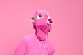 Creative crazy pink photo on a pink background with pink clothes and accessories, cyberpunk concept and conceptual art