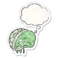 A creative cute cartoon old turtle and thought bubble as a distressed worn sticker Royalty Free Stock Photo