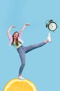 Creative 3d photo artwork graphics collage of funny funky girl standing citrus slice beating clock isolated blue color