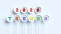 Creative 3D render of 2026 and TRENDS text on white circular buttons with colorful letters and numbers on a light blue background Royalty Free Stock Photo