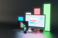 Creative dark neon designer desktop with glowing laptop computer monitors, smartphone screen and business charts, graphs and Royalty Free Stock Photo