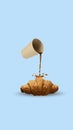Creative design. Black coffee spilling on delicious croissant on blue background, Breakfast time. Poster