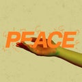 Creative design. Human hand showing big peace lettering isolated on yellow background.