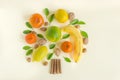 Creative design layout of fruits and nuts. Tree of lemons, oranges, persimmons, banana, almonds and green leaves. Concept- Royalty Free Stock Photo