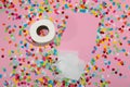 creative design, pink background with colorful chopped paper that is an outline of a sheet of toilet paper